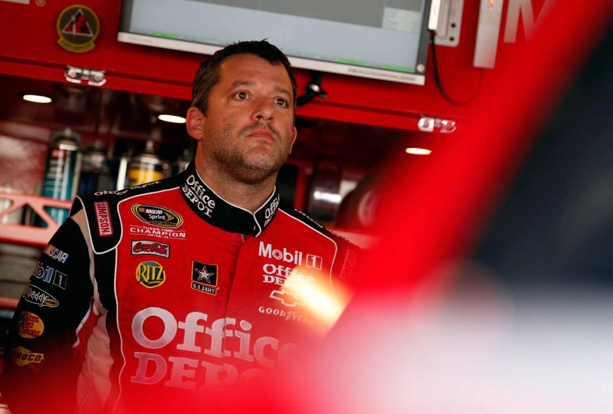 NASCAR driver Tony Stewart wears his red Office Depot suit before a race