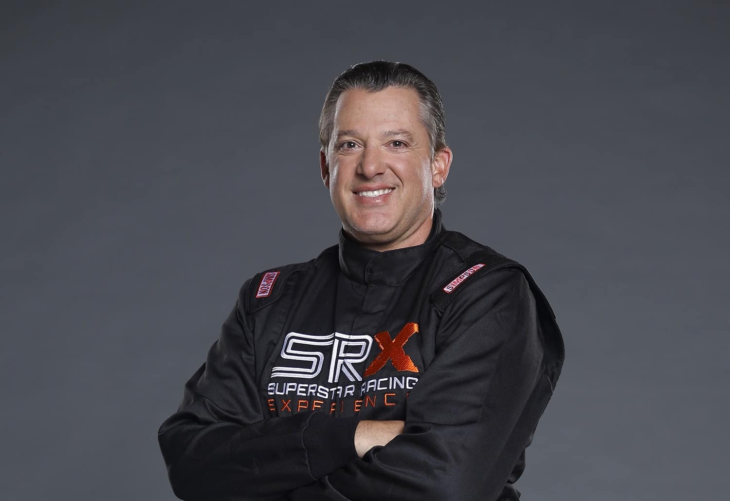 SRX driver Tony Stewart poses for a photo during the Superstar Racing Experience portrait shoot at Clutch Studios on April 25, 2023 in Huntersville, North Carolina.