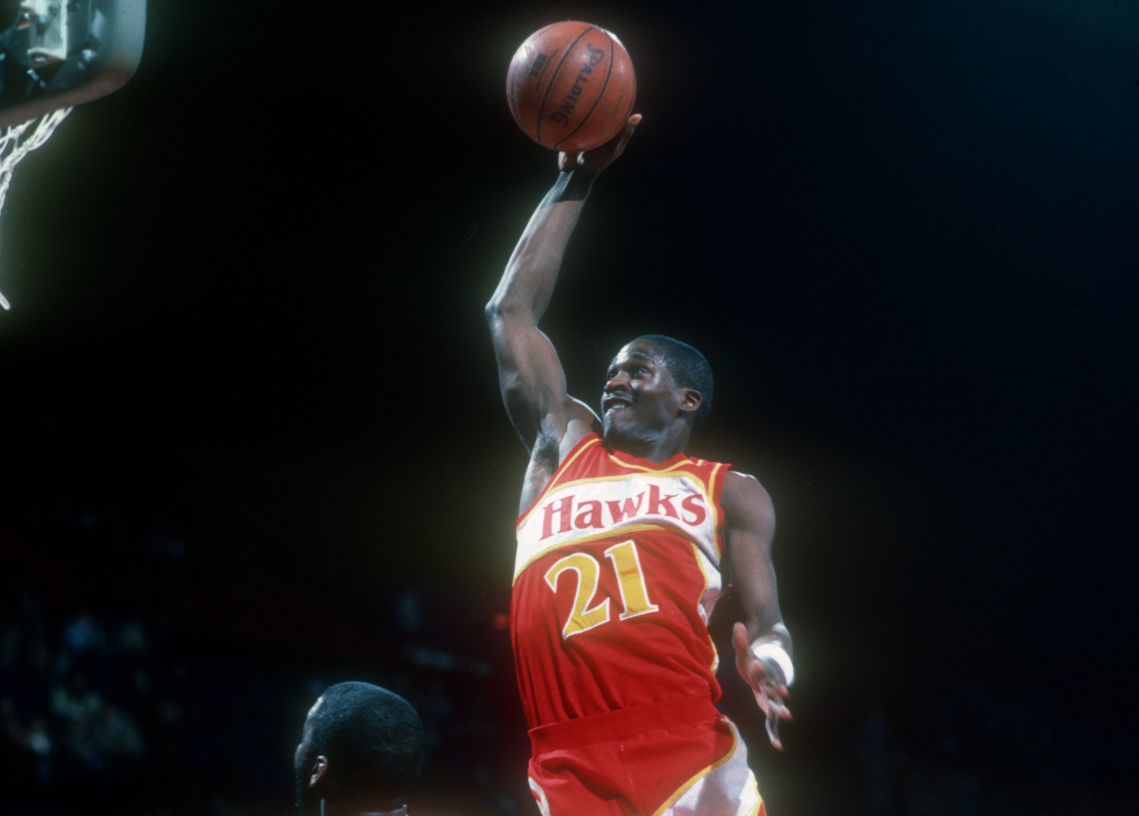 Dominique Wilkins of the Atlanta Hawks drives to the basket during a NBA game against the Washington Bullets.