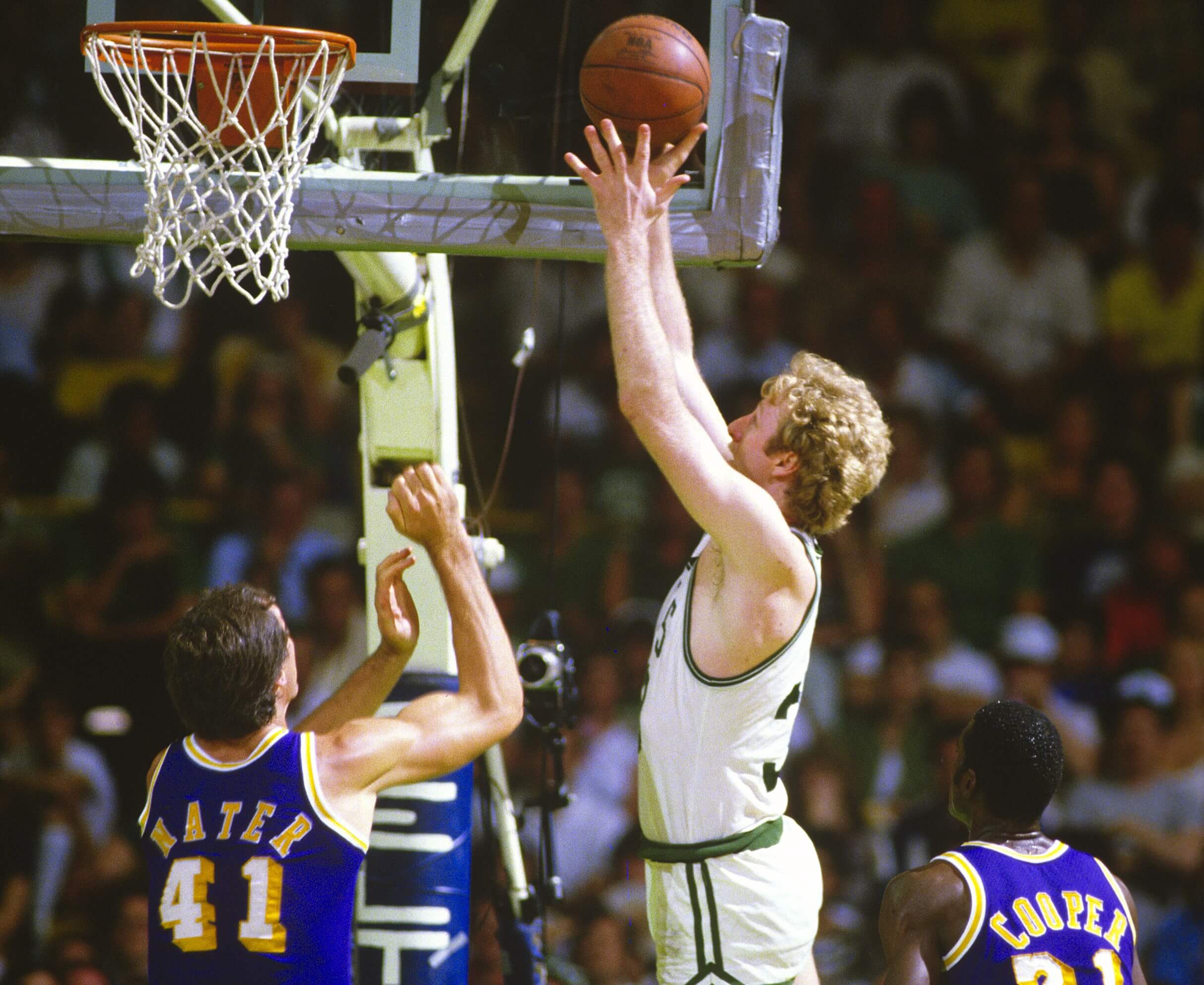 Larry Bird of the Boston Celtics shoots over Swen Nater of the Los Angeles Lakers.