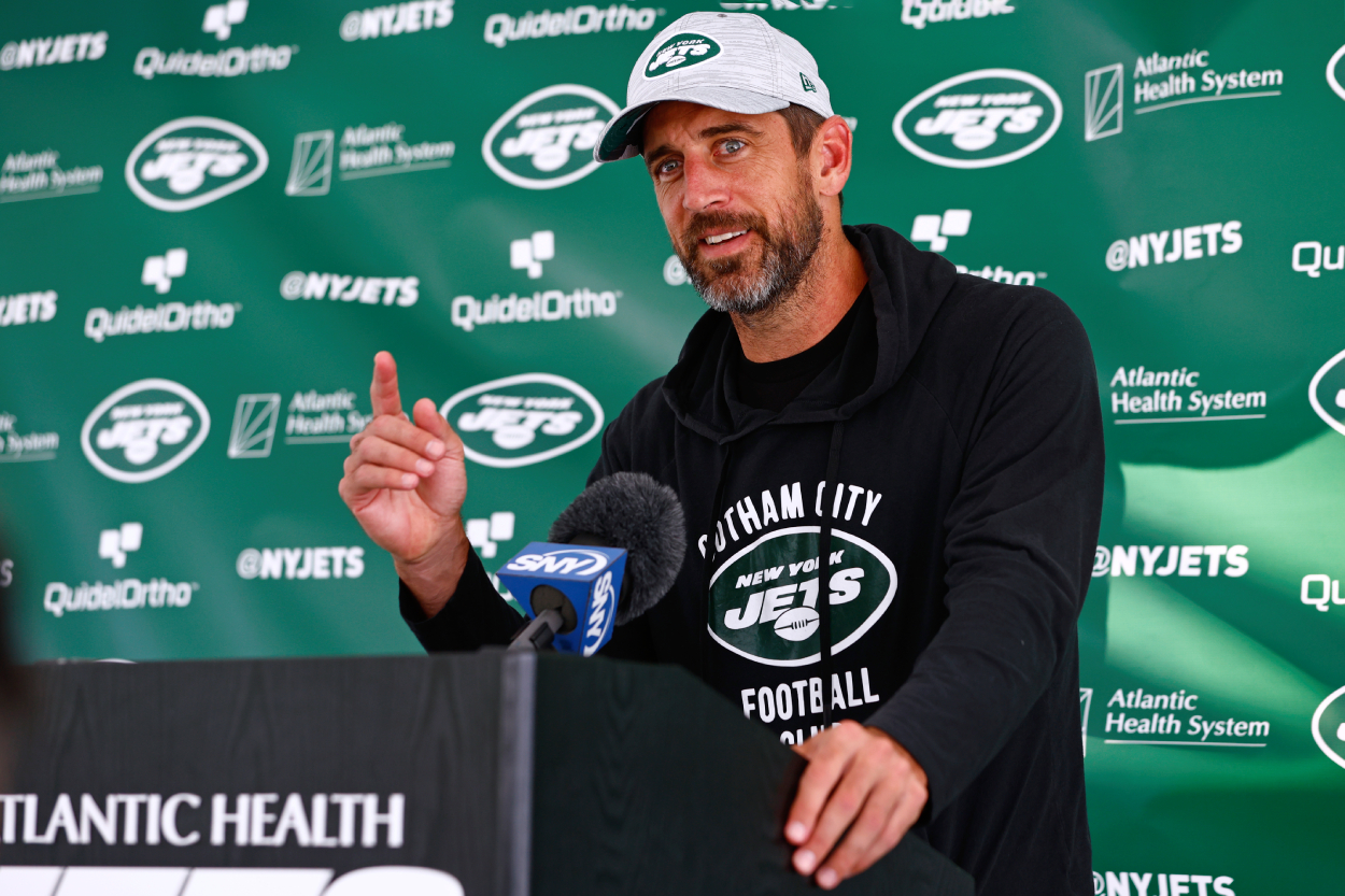 Quarterback Aaron Rodgers of the New York Jets talks to reporters.