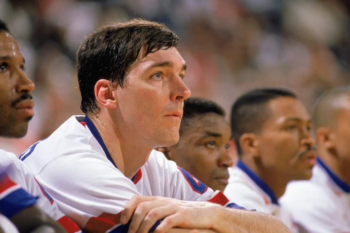 Detroit Pistons legend Bill Laimbeer watches the action from the bench