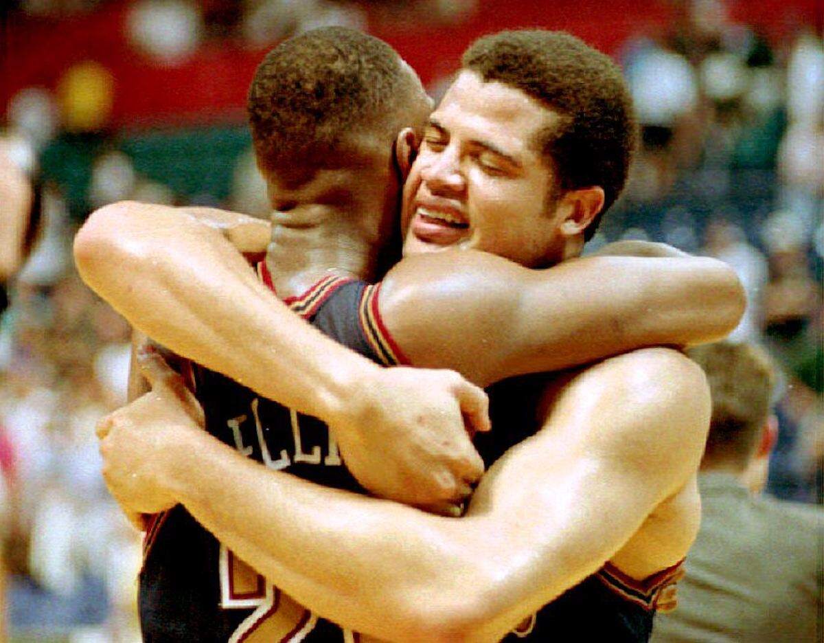 Nuggets Brian Williams hugs teammate LaPonson Ellis after Denver beat the Seattle SuperSonics in overtime in 1994