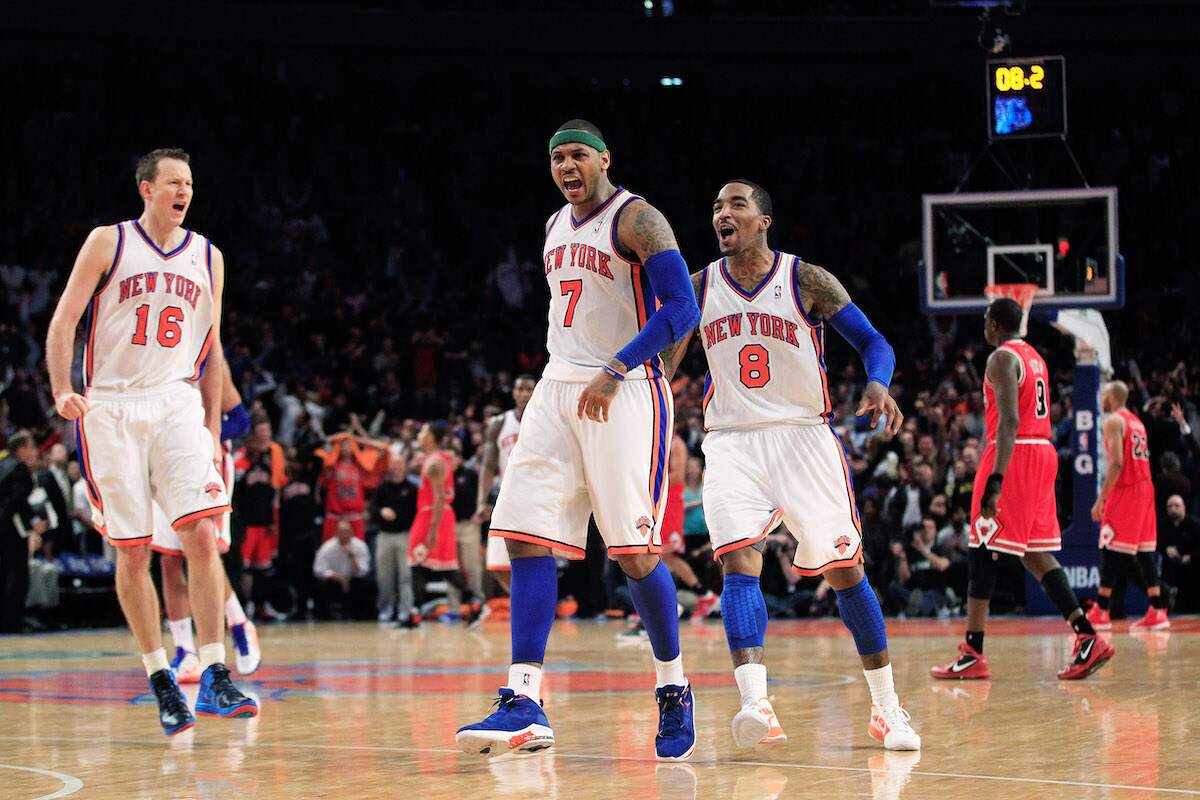 Carmelo Anthony of the New York Knicks celebrates his game-winning three-pointer against the Chicago Bulls at Madison Square Garden on April 8, 2012