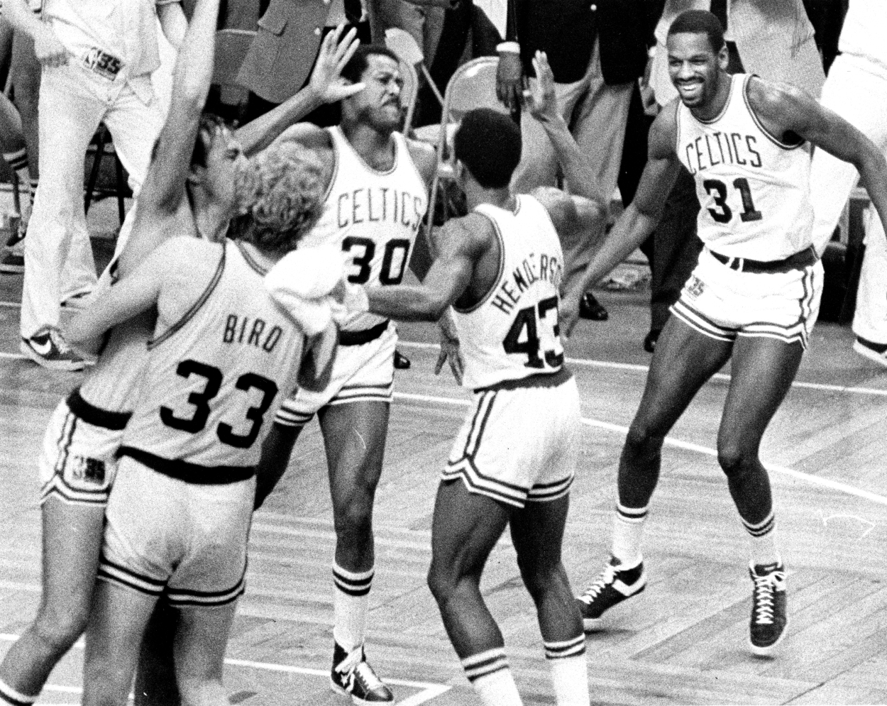 From left, Boston Celtics' Chris Ford, Larry Bird, M.L. Carr, Gerald Henderson and Cedric Maxwell celebrate the win over Philadelphia.