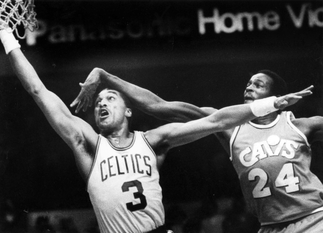 Boston Celtics Dennis Johnson shoots around Cleveland Cavaliers Keith Lee.