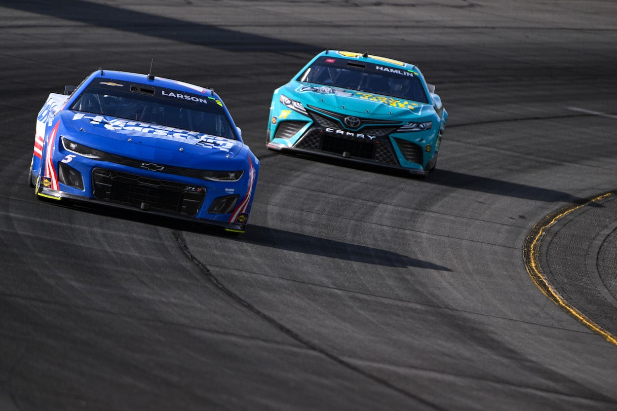 Kyle Larson and Denny Hamlin race