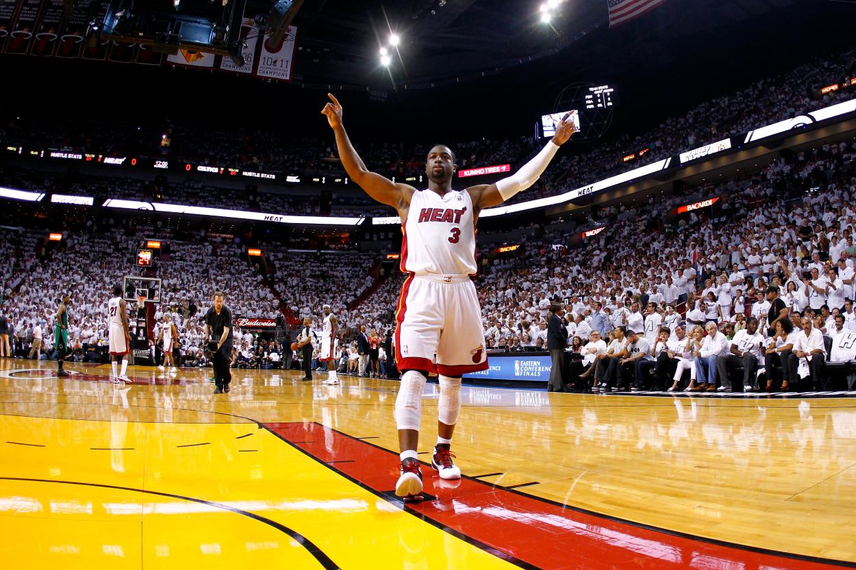 Dwyane Wade of the Miami Heat gestures toward the Heat fans.
