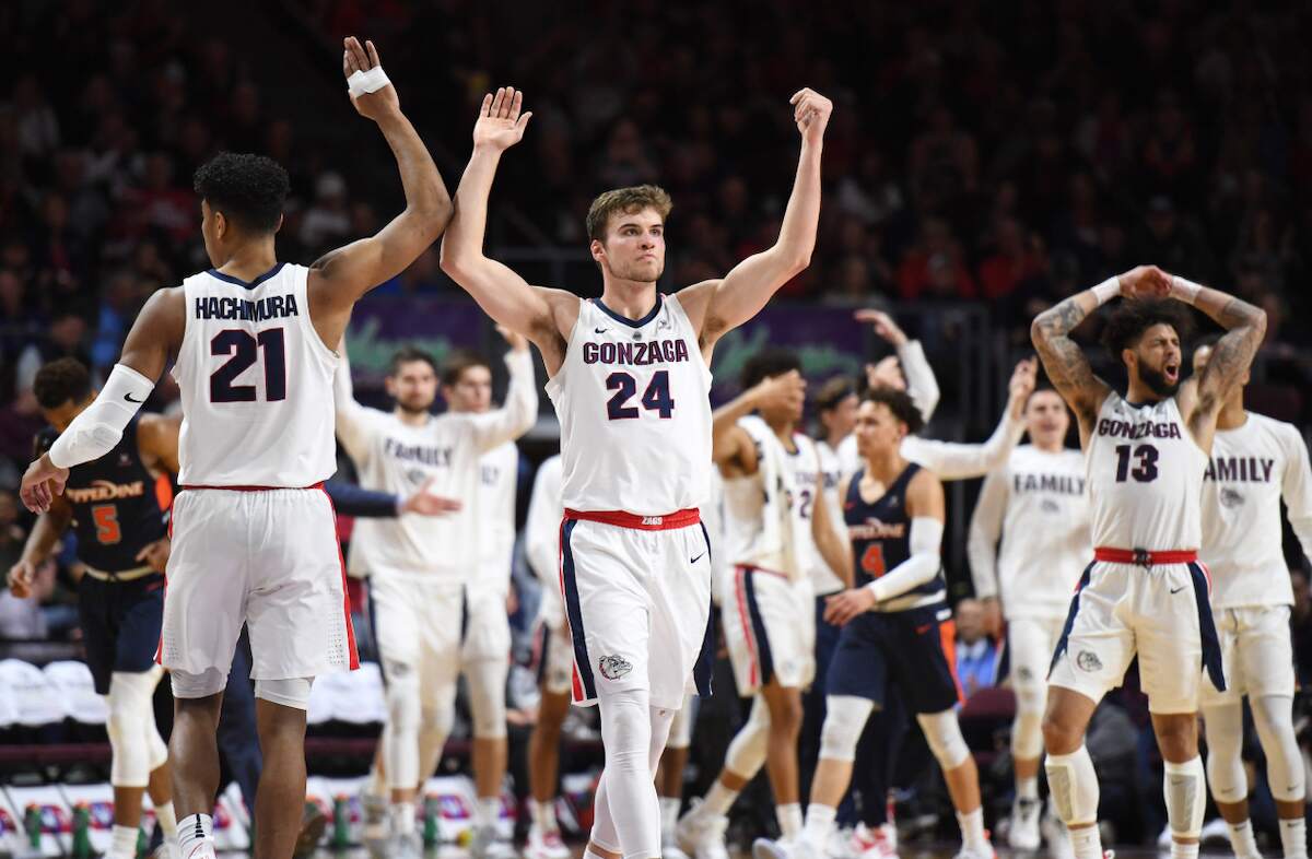 Rui Hachimura (from left) and Corey Kispert of the Gonzaga Bulldogs celebrate during the West Coast Conference basketball tournament on March 11, 2019