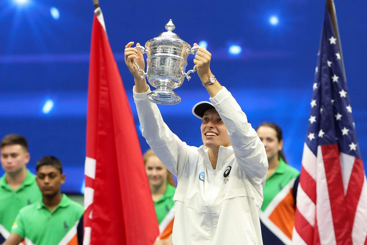 Winner Iga Swiatek of Poland holds up her U.S. Open trophy