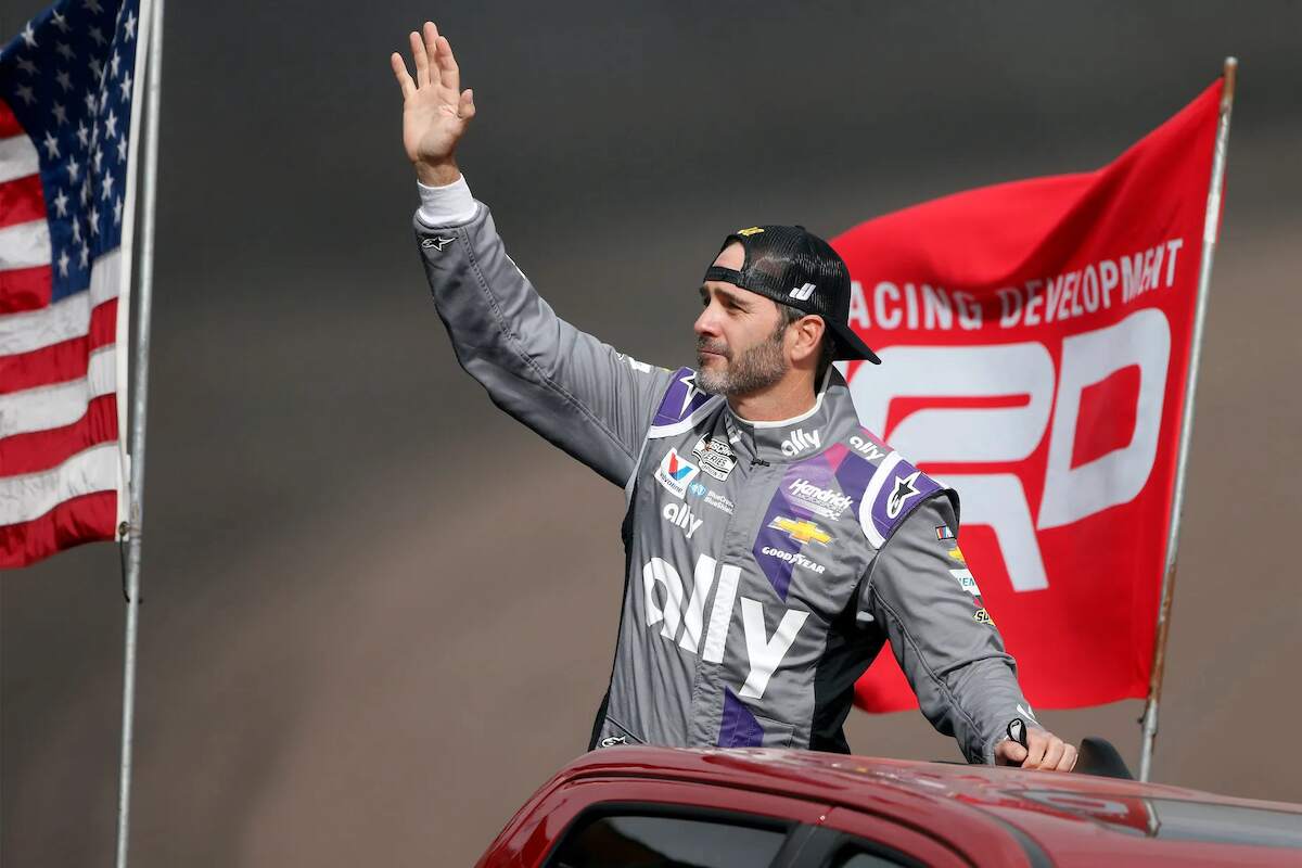 NASCAR legend Jimmie Johnson waves to the crowd