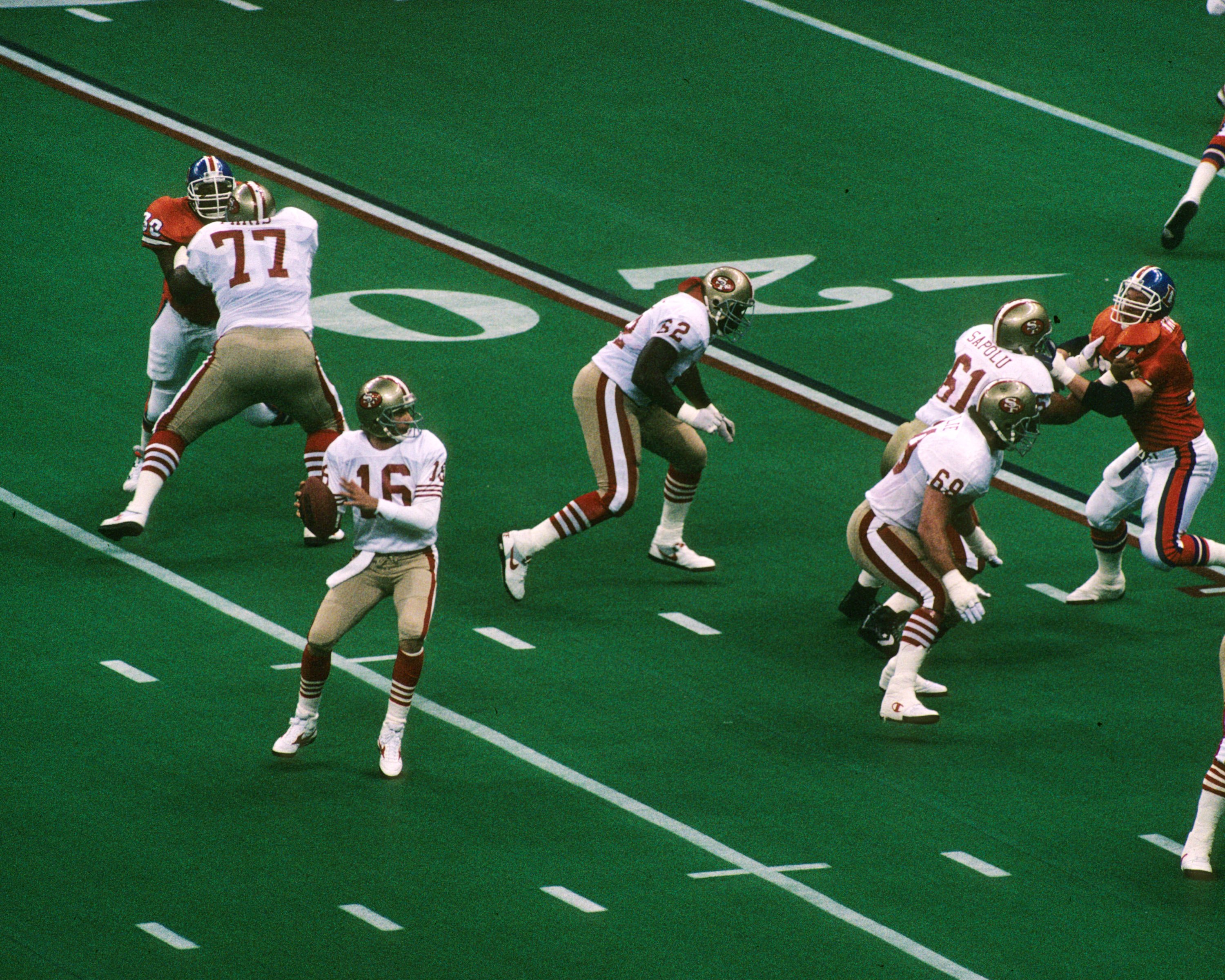 Quarterback Joe Montana of the San Francisco 49ers sets up to pass against the Denver Broncos.