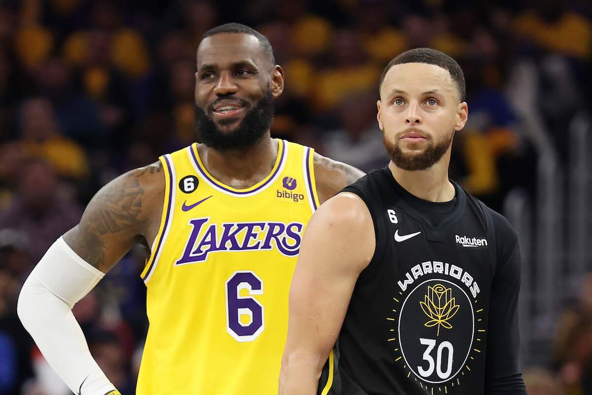 LeBron James of the Los Angeles Lakers stands next to Stephen Curry of the Golden State Warriors during the second quarter of a game