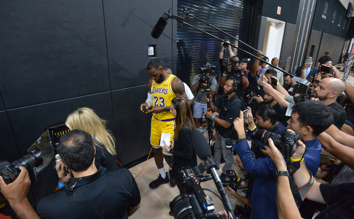 LeBron James checks his phone at Los Angeles Lakers Media Day.