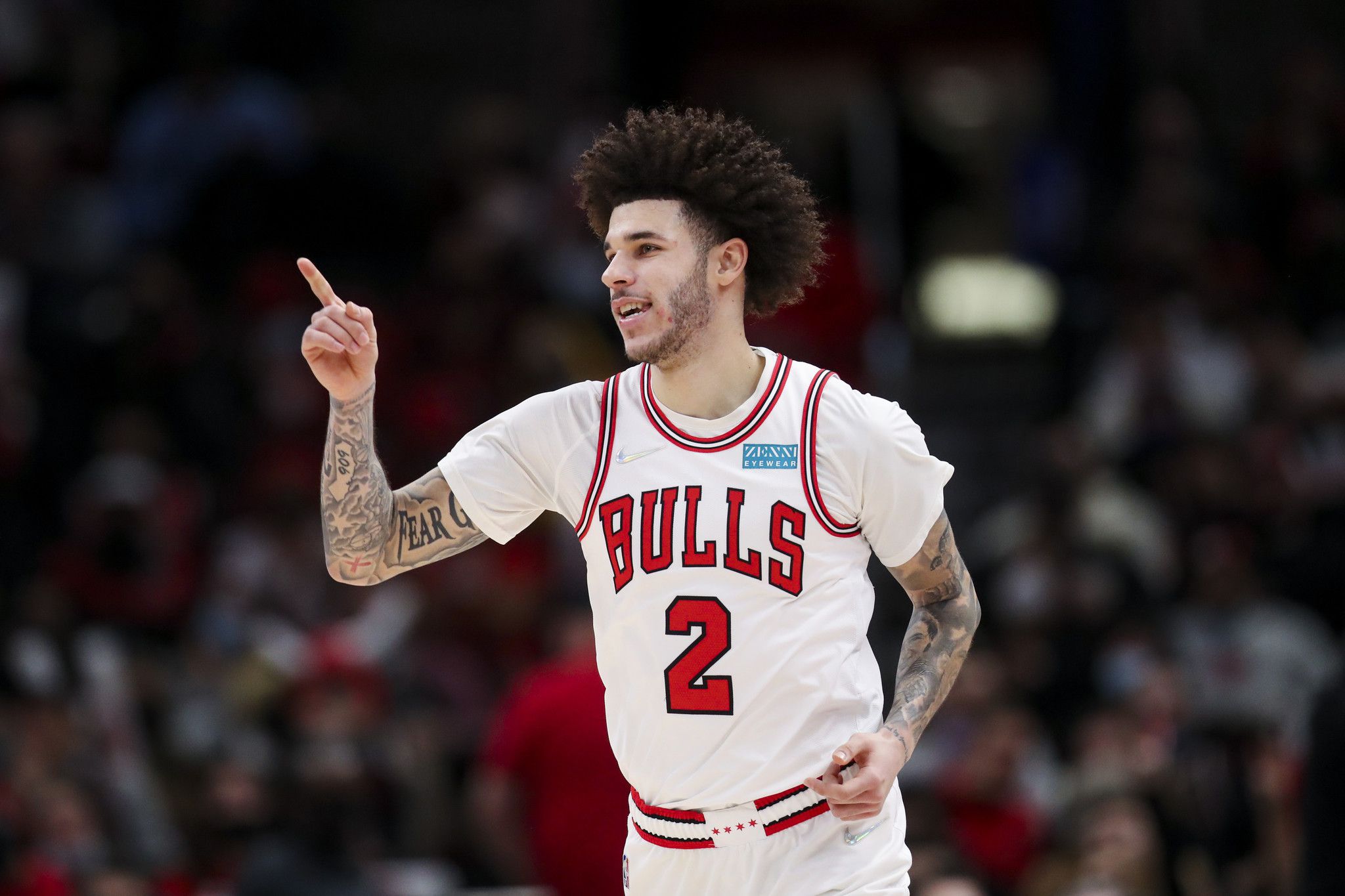 Chicago Bulls guard Lonzo Ball smiles after making a three-point-shot during the second half against the Detroit Pistons at the United Center on Jan. 11, 2022.