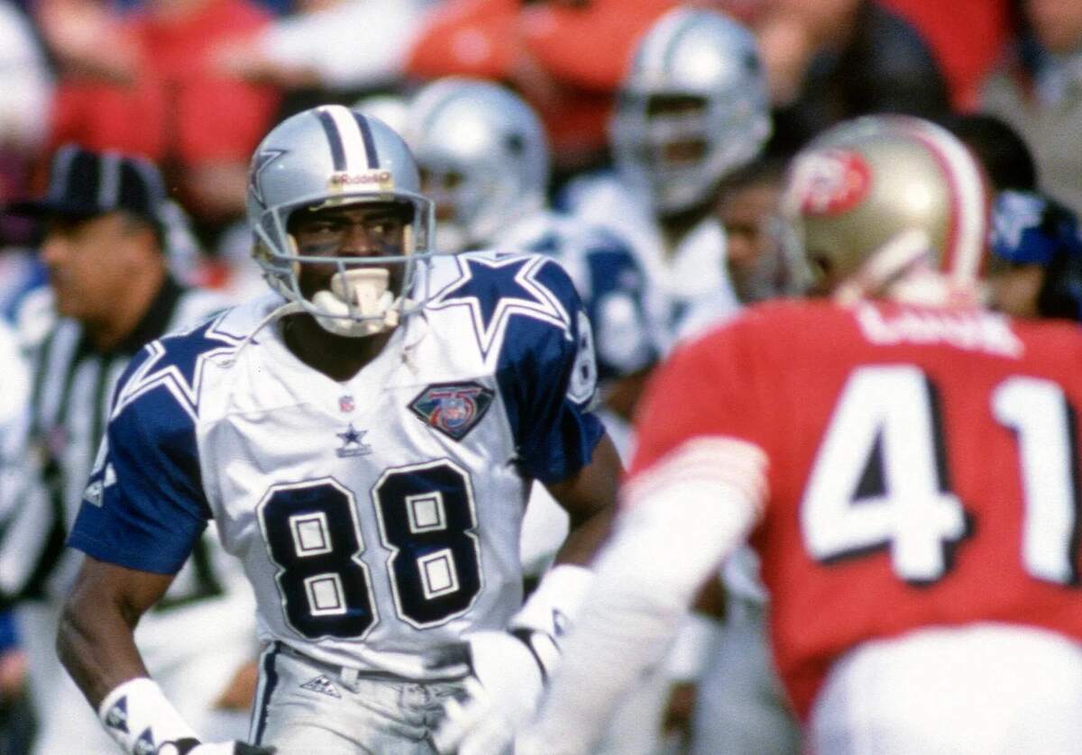 Dallas Cowboys receiver Michael Irvin carries the ball down the field