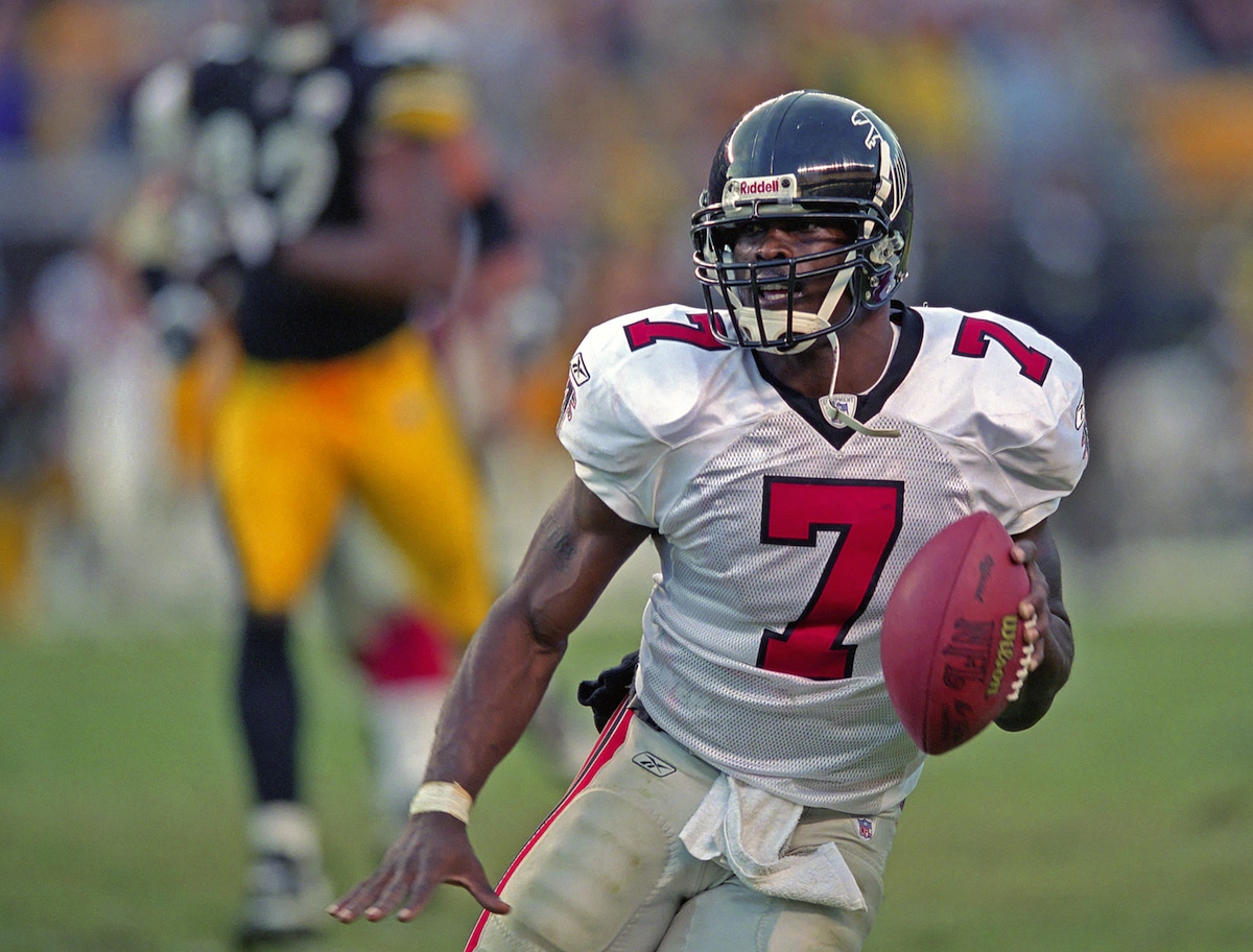 Michael Vick runs with the football for the Atlanta Falcons