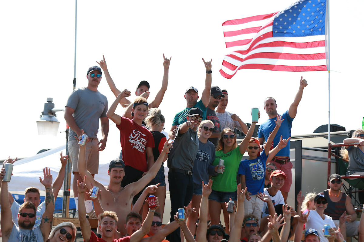 NASCAR fans cheer.