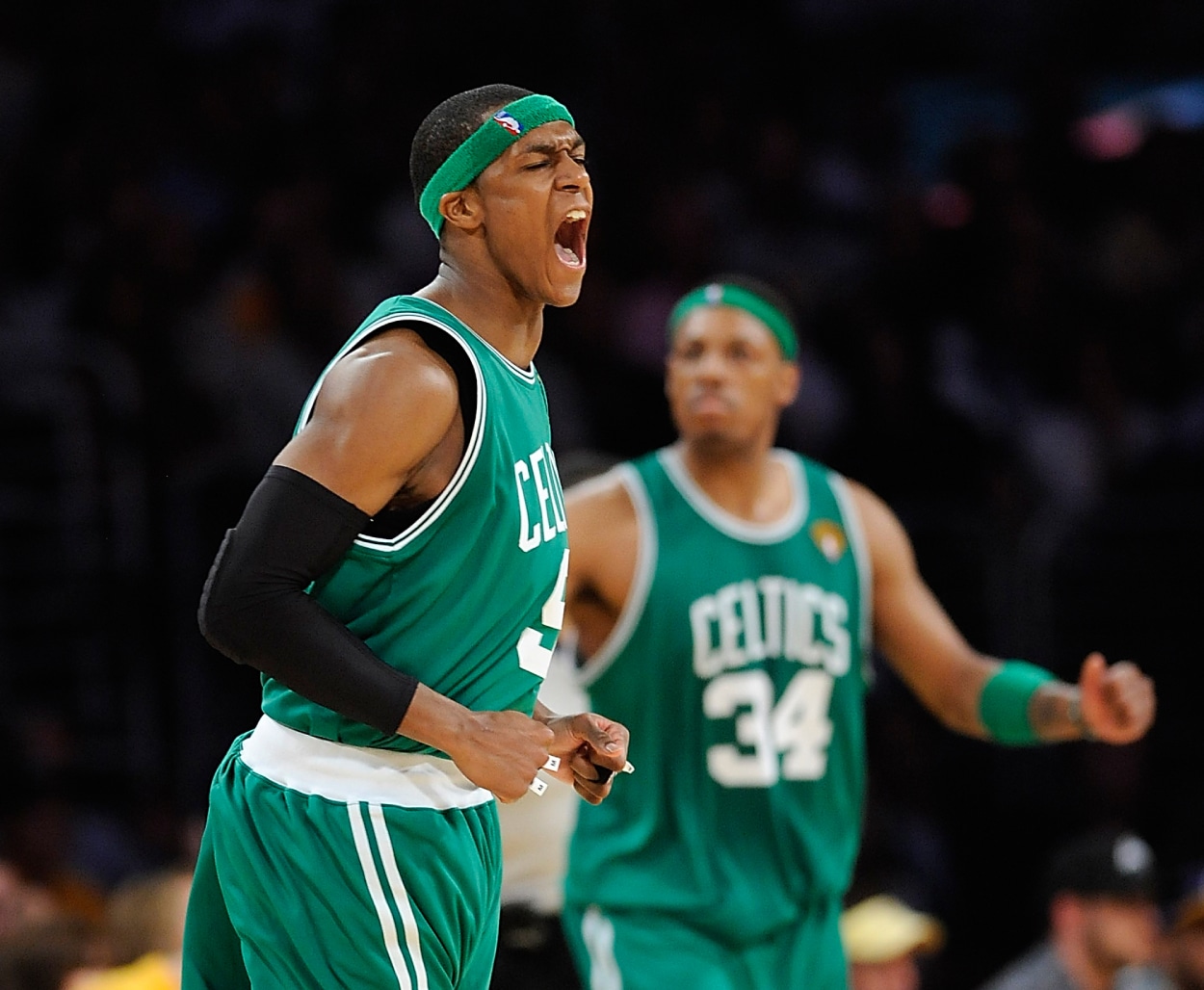 Boston Celtics guard Rajon Rondo, left, and Boston Celtics forward Paul Pierce celebrate Rondo's basket.