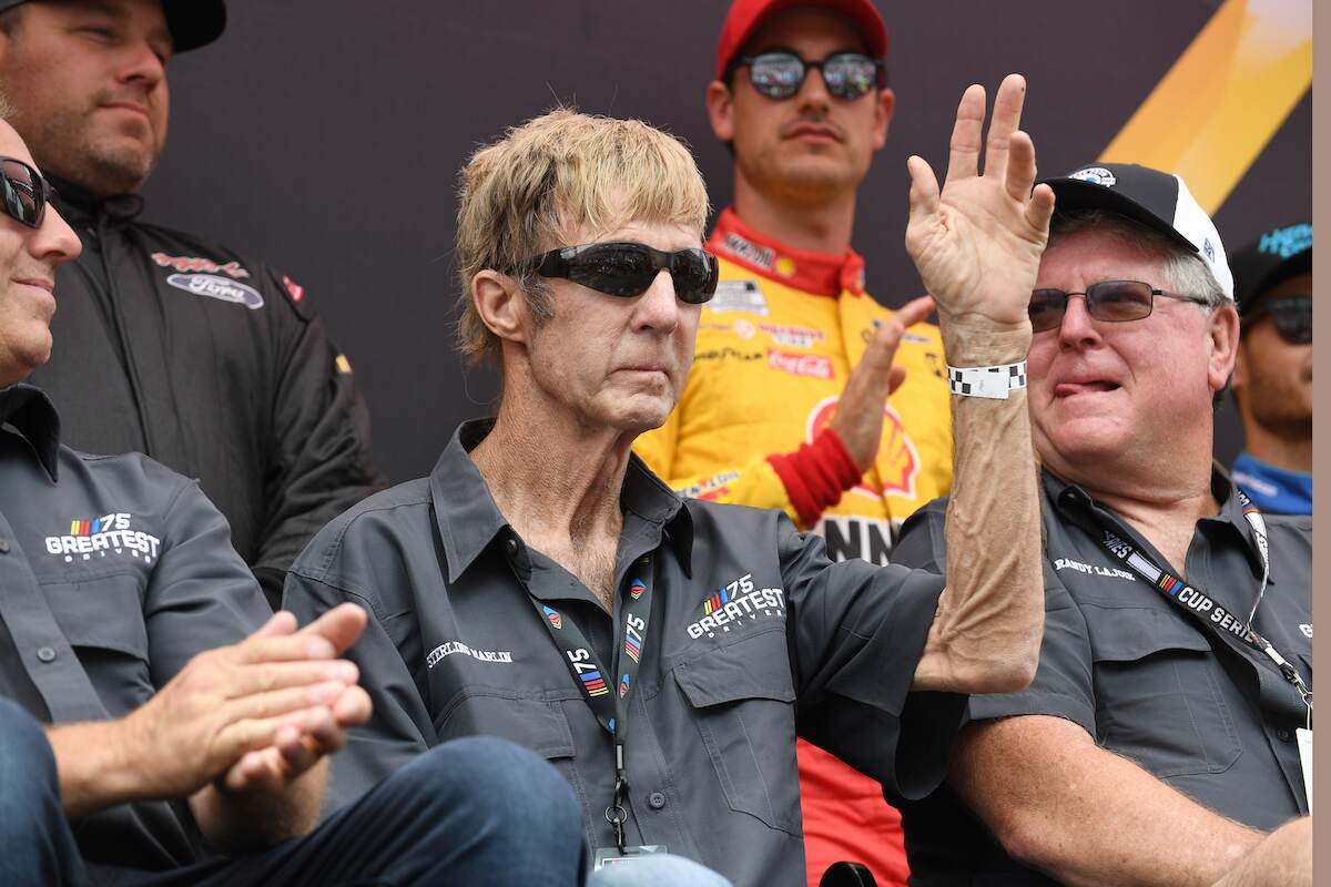 Retired driver Sterling Marlin waves to the crowd as he's honored as one of the top NASCAR 75 drivers prior to the running of the NASCAR Cup Series Goodyear 400 on May 14, 2023