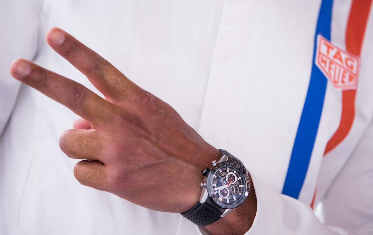 A TAG Heuer watch is worn by a Formula One driver during a media event