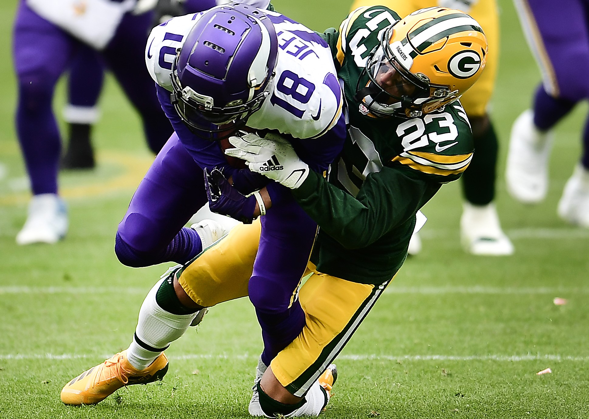 Justin Jefferson of the Minnesota Vikings runs as Jaire Alexander of the Green Bay Packers defends.