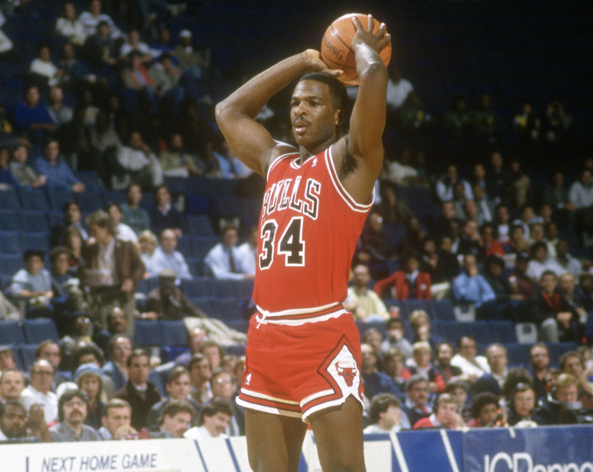 Charles Oakley of the Chicago Bulls looks to pass the ball against the Washington Bullets.