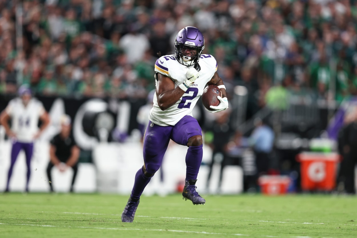 Alexander Mattison of the Minnesota Vikings runs with the ball.