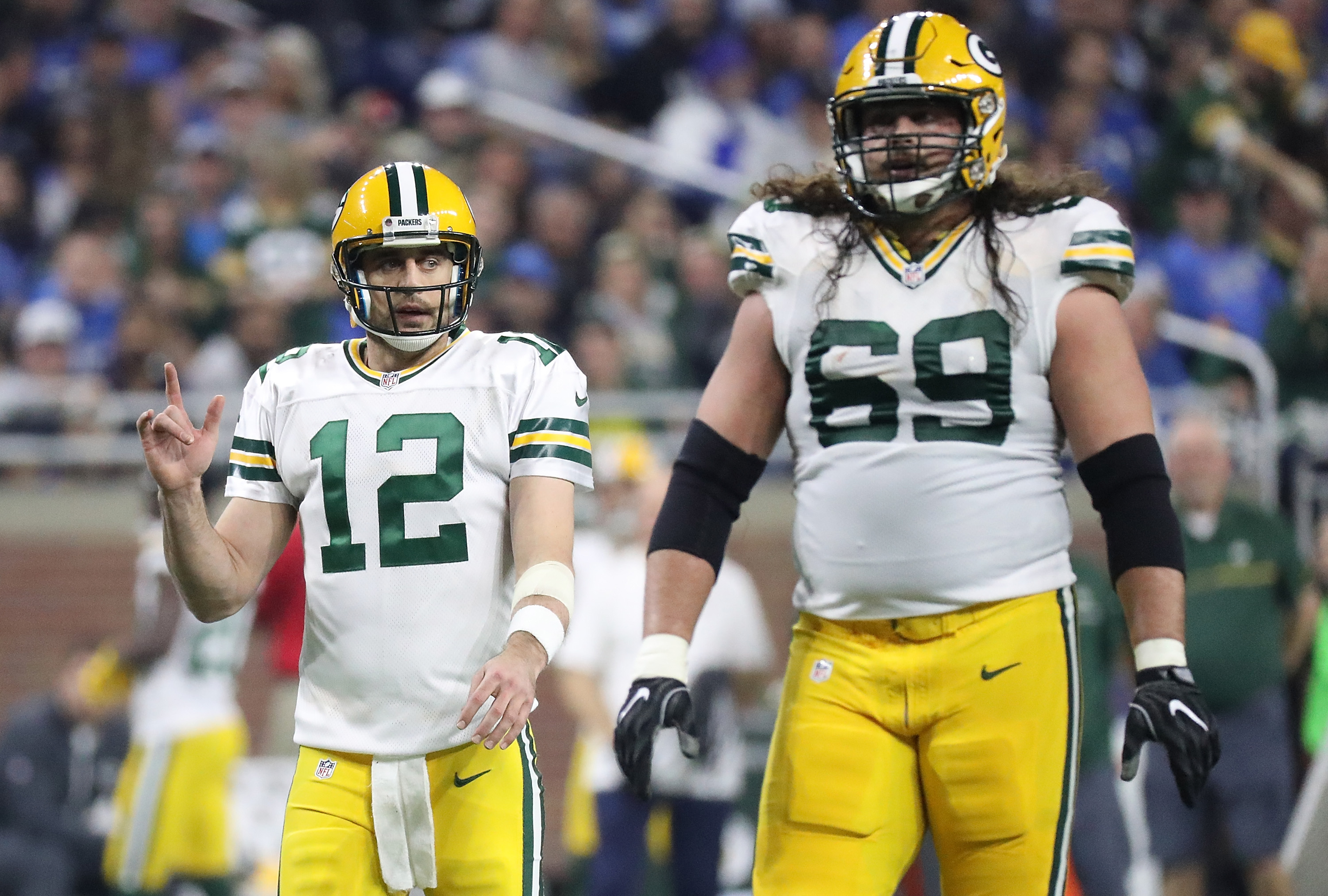 Aaron Rodgers and David Bakhtiari of the Green Bay Packers walk to the line.