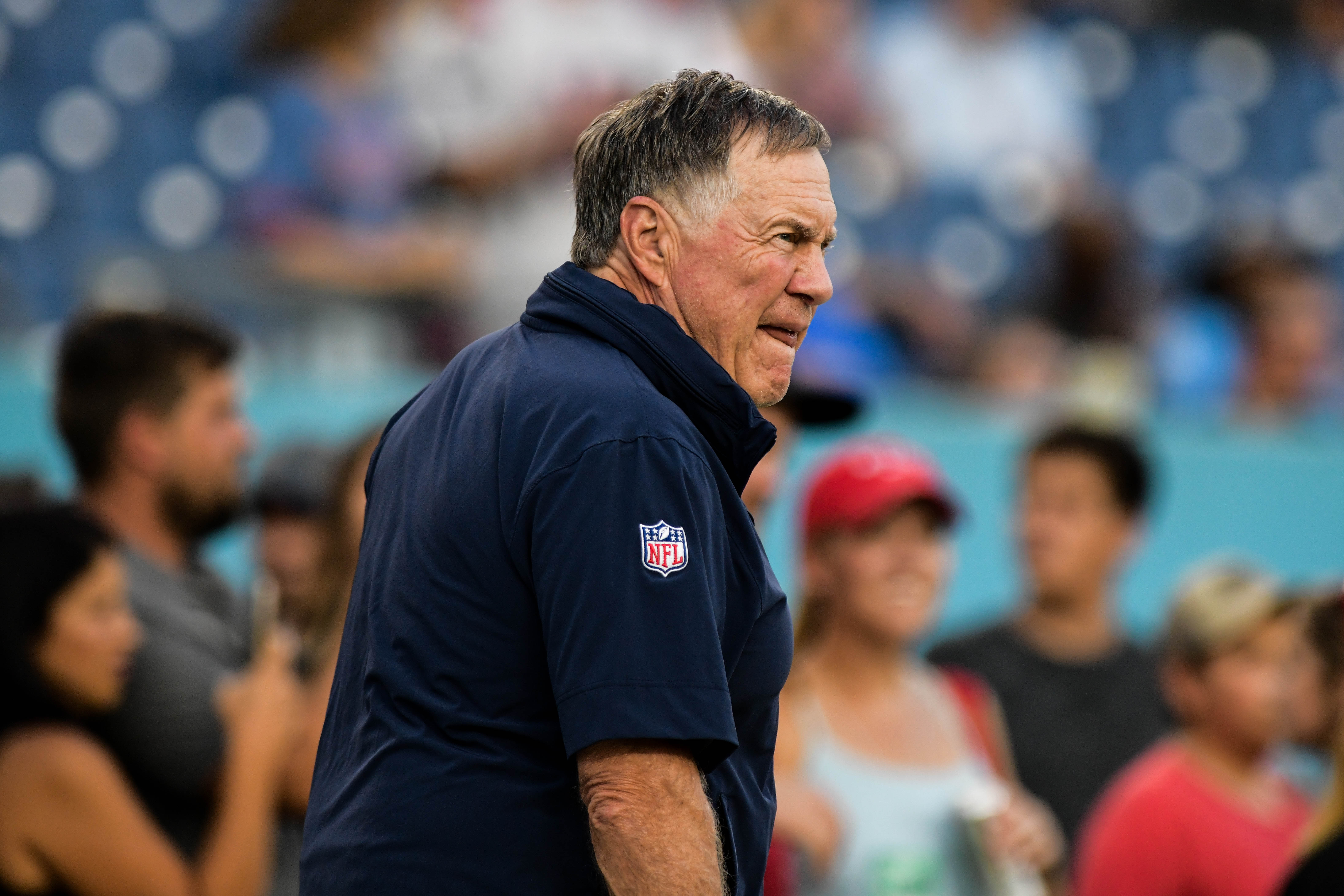 Bill Belichick of the New England Patriots walks on the sideline before the preseason game against the Tennessee Titans.