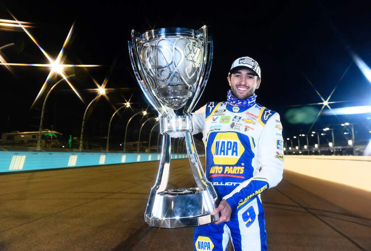 NASCAR driver Chase Elliott holds the trophy from the 2020 NASCAR Cup Series title