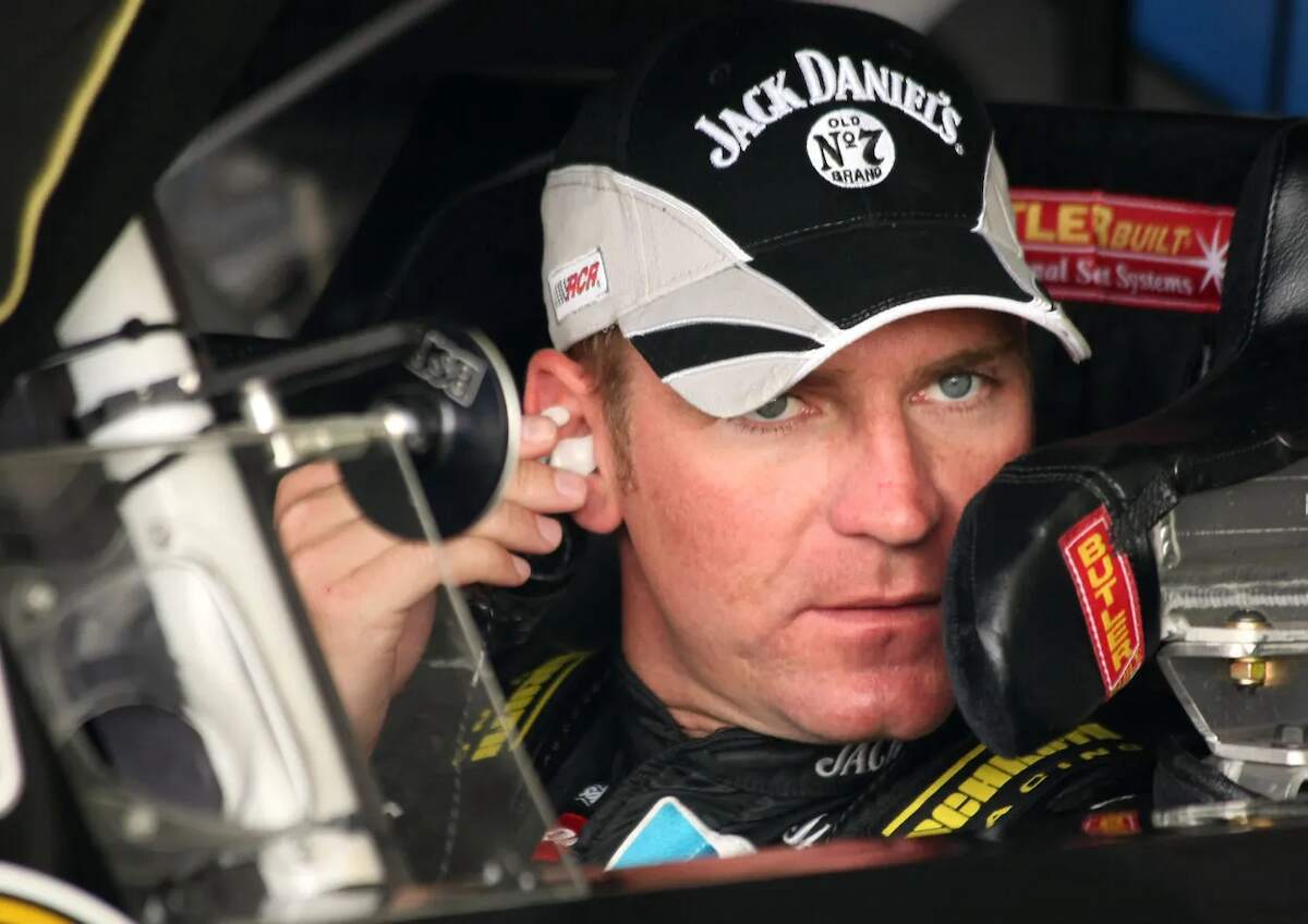 Clint Bowyer adjusts his earphone during a race in 2007