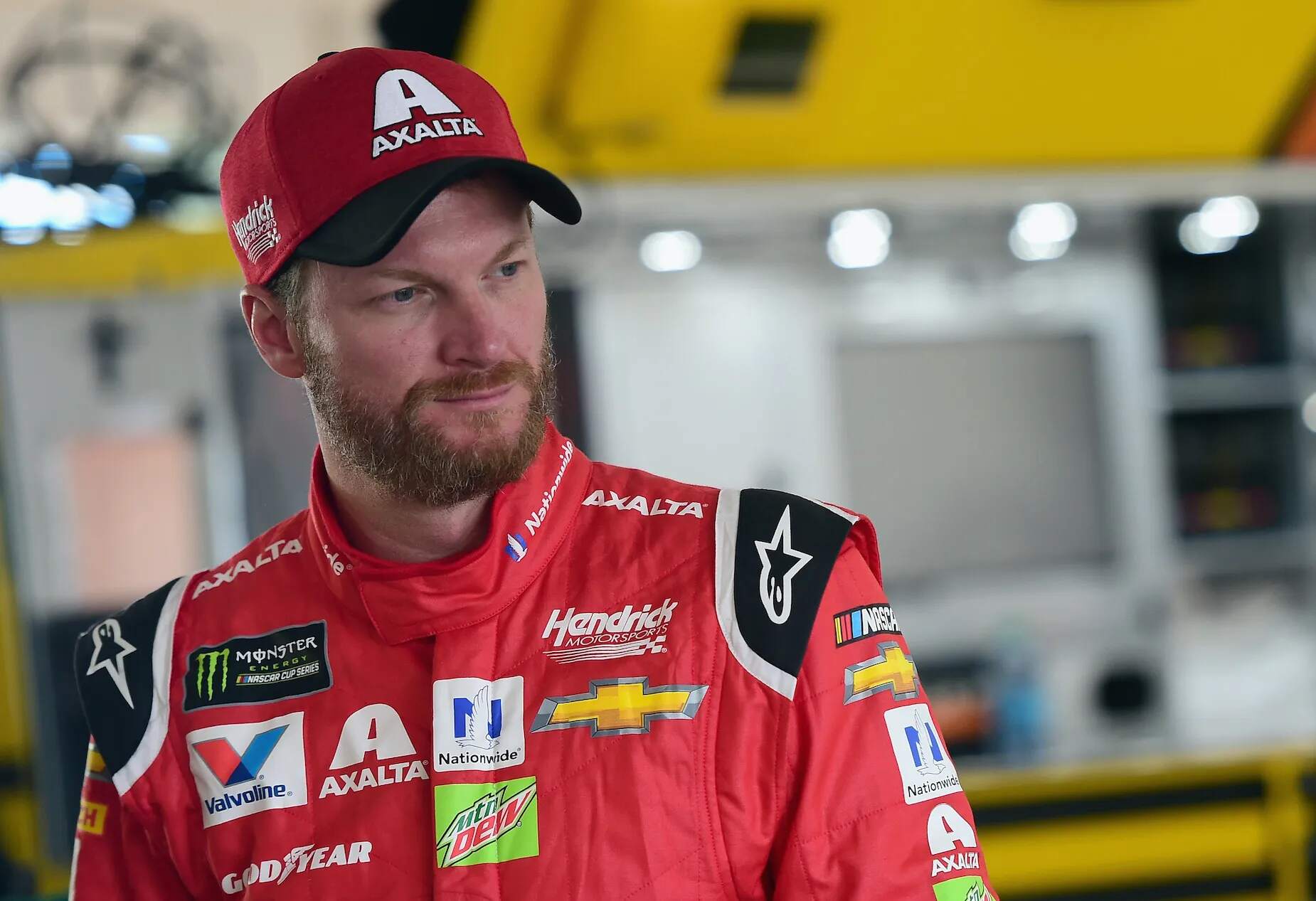 NASCAR star Dale Earnhardt Jr. stands in the garage