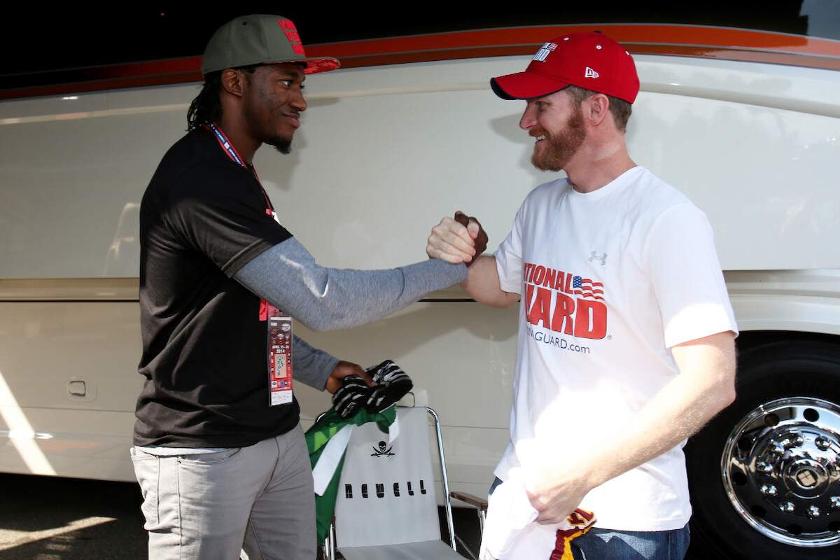 Robert Griffin III, of the now-Washington Commanders, meets with Dale Earnhardt Jr. in 2014