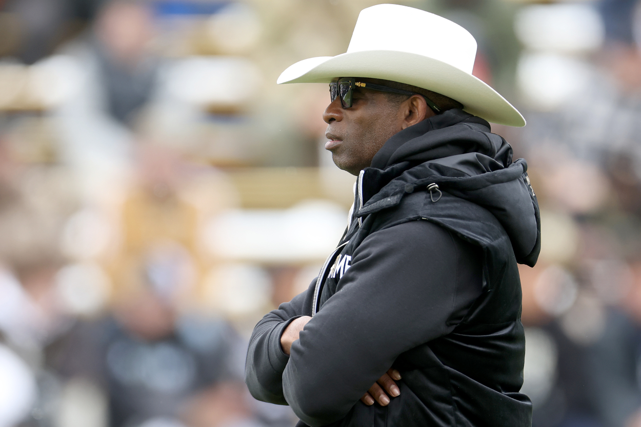 Head coach Deion Sanders of the Colorado Buffaloes watches as his team warms up prior to their spring game at Folsom Field on April 22, 2023.
