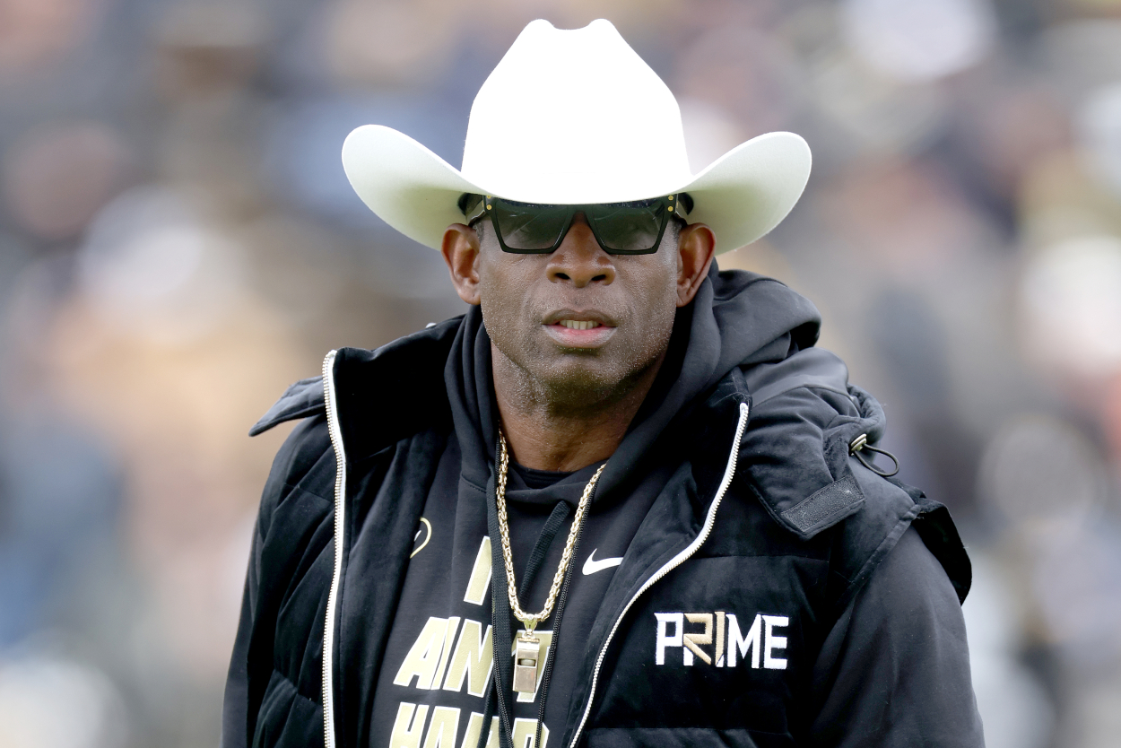 Head coach Deion Sanders of the Colorado Buffaloes watches as his team warms up prior to their spring game.