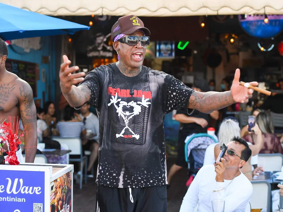 Dennis Rodman, who is a fan of Pearl Jam, wears one of the band's shirts.