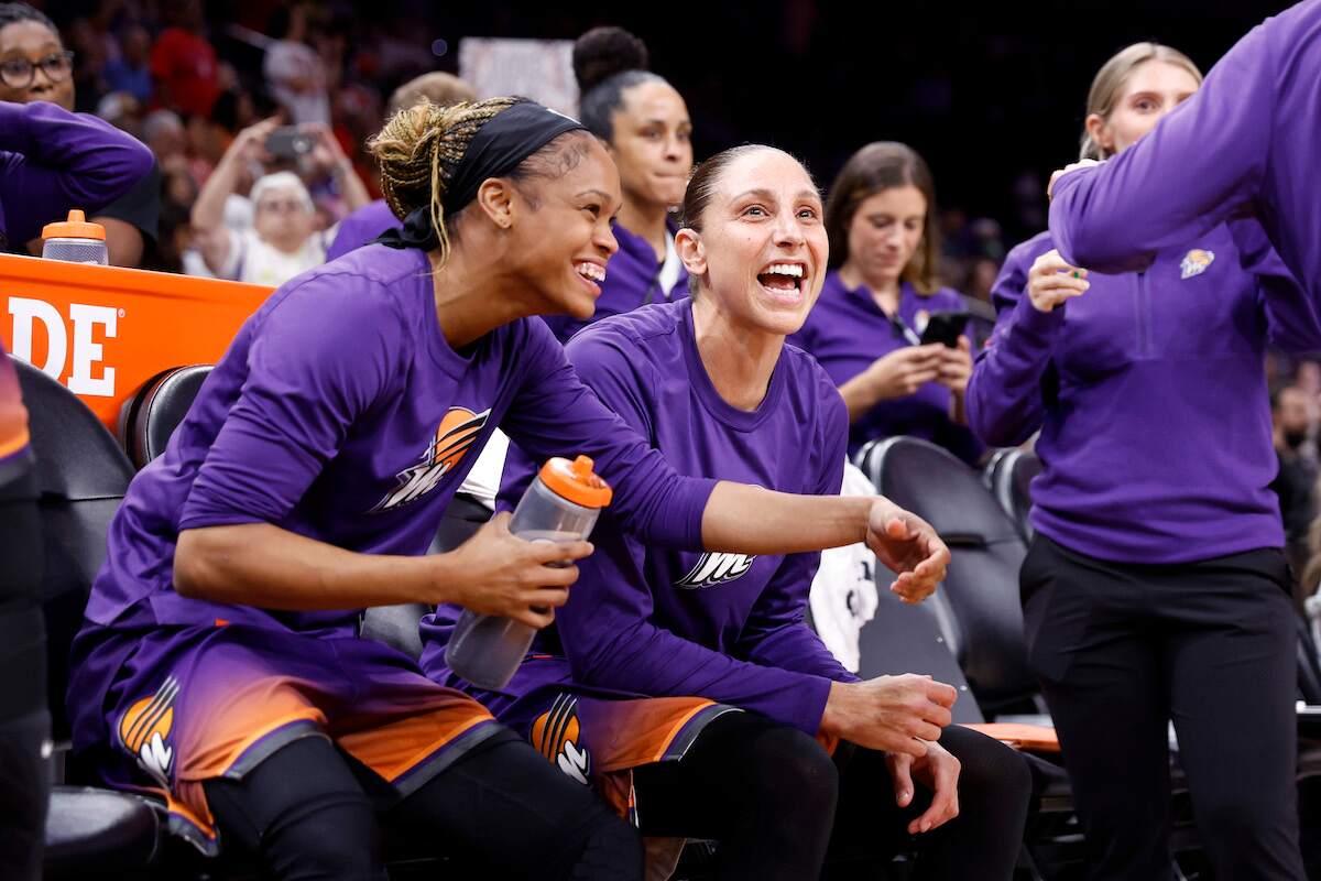 Guard Diana Taurasi of the Phoenix Mercury smiles with her teammates before a game