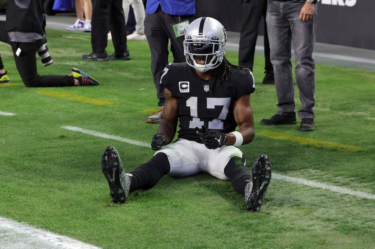 Wide receiver Davante Adams of the Las Vegas Raiders briefly sits out of bounds after a pass intended for him in the end zone was broken up