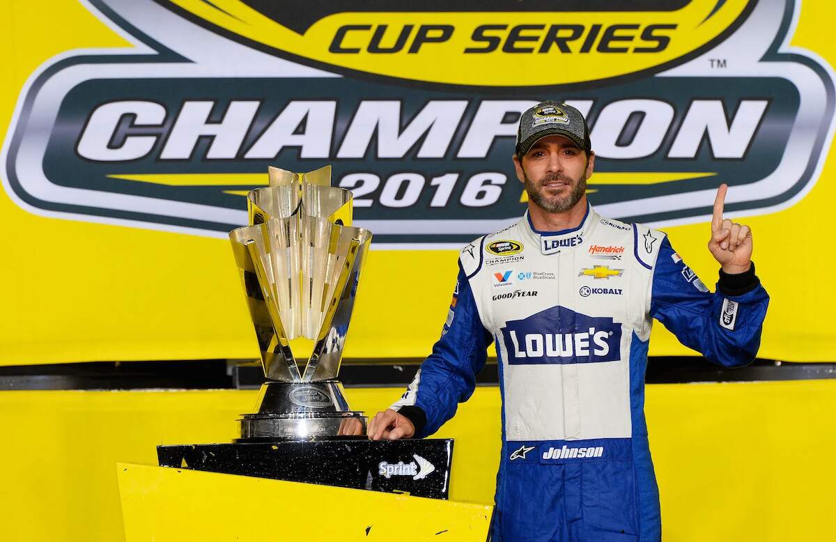 NASCAR star Jimmie Johnson poses with the Sprint Cup trophy