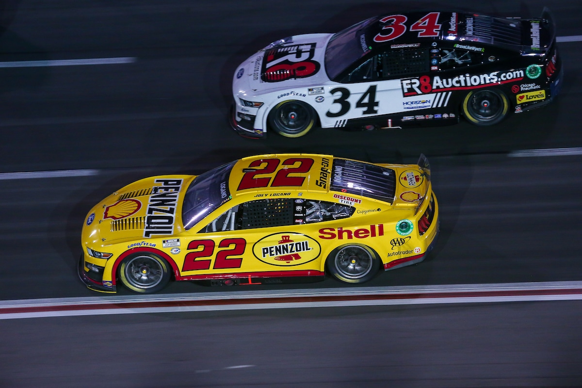 Joey Logano and Michael McDowell race