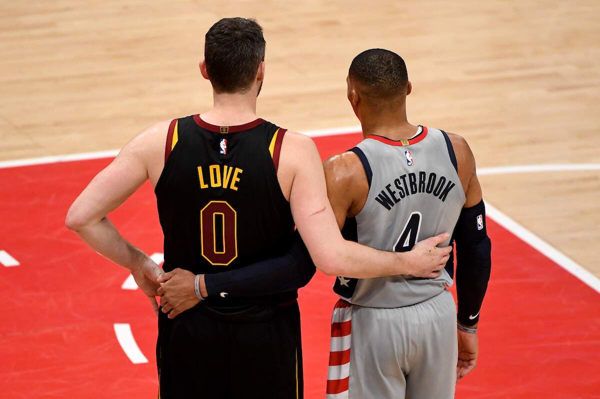 Kevin Love of the Cleveland Cavaliers and Russell Westbrook of the Washington Wizards speak during the second half of a 2021 NBA game
