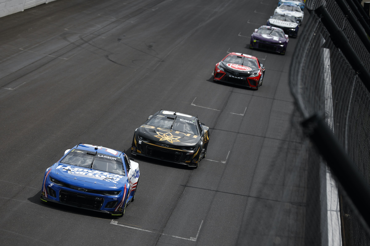 Kyle Larson and Kyle Busch race at Indy.