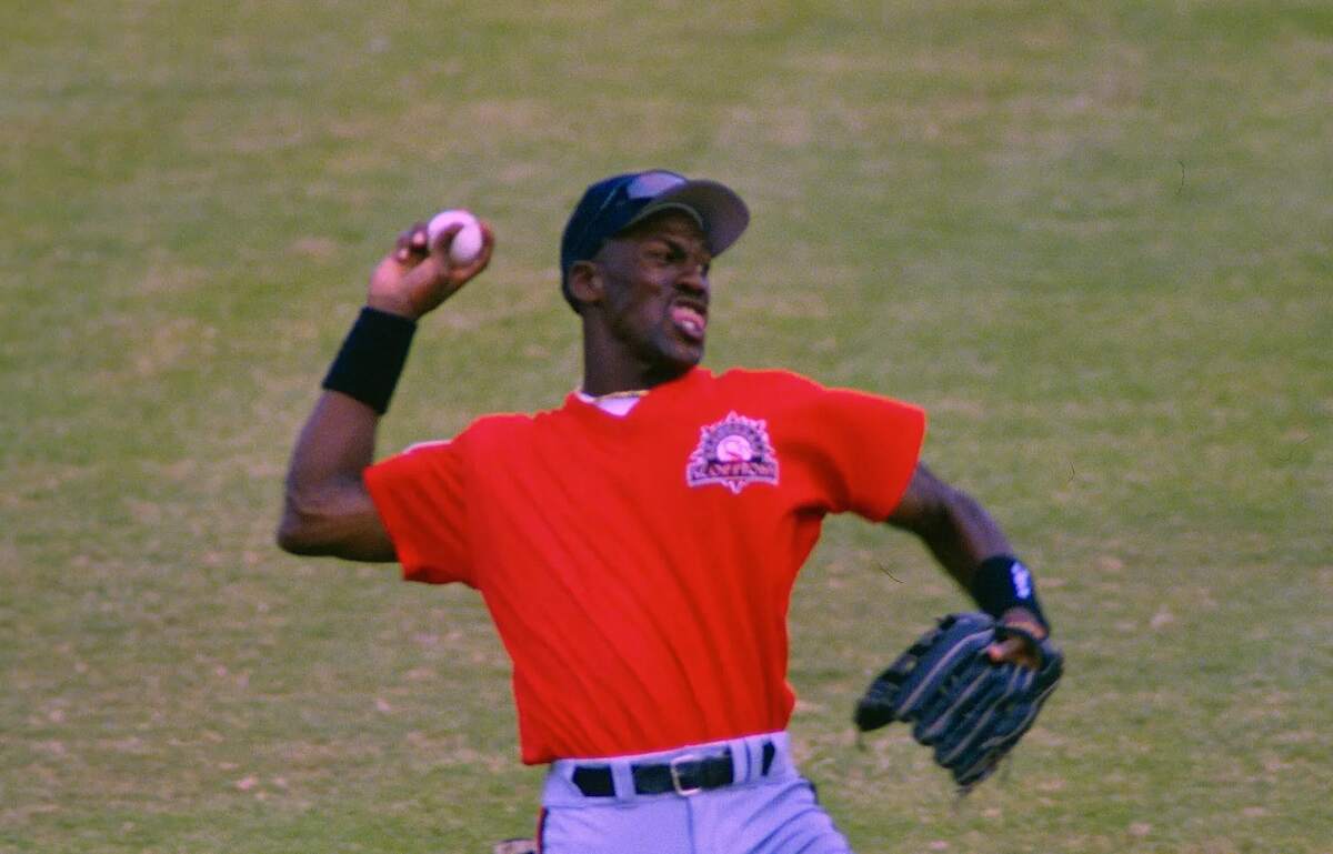 NBA star Michael Jordan throws the baseball from the outfielda