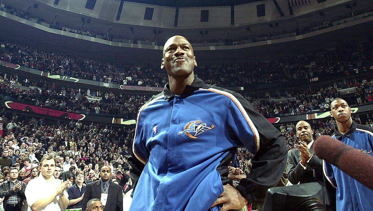 Michael Jordan gets emotional during an ovation after player introductions in his return to the United Center with the Washington Wizards in 2002