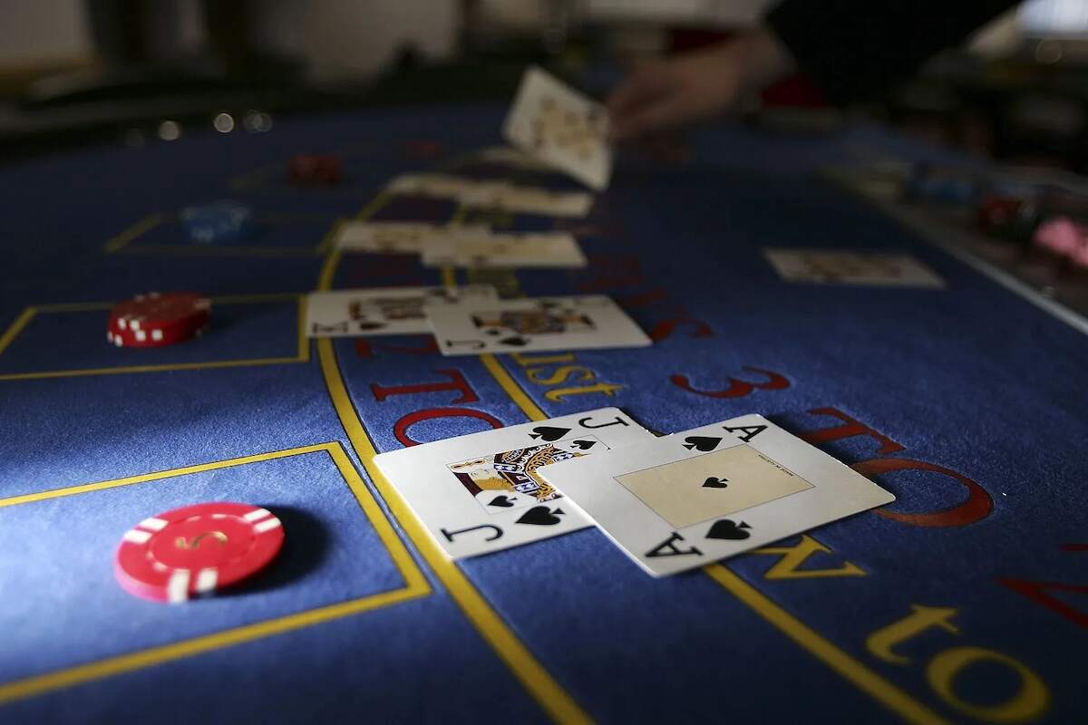 Blackjack cards and chips laid out on a blackjack table
