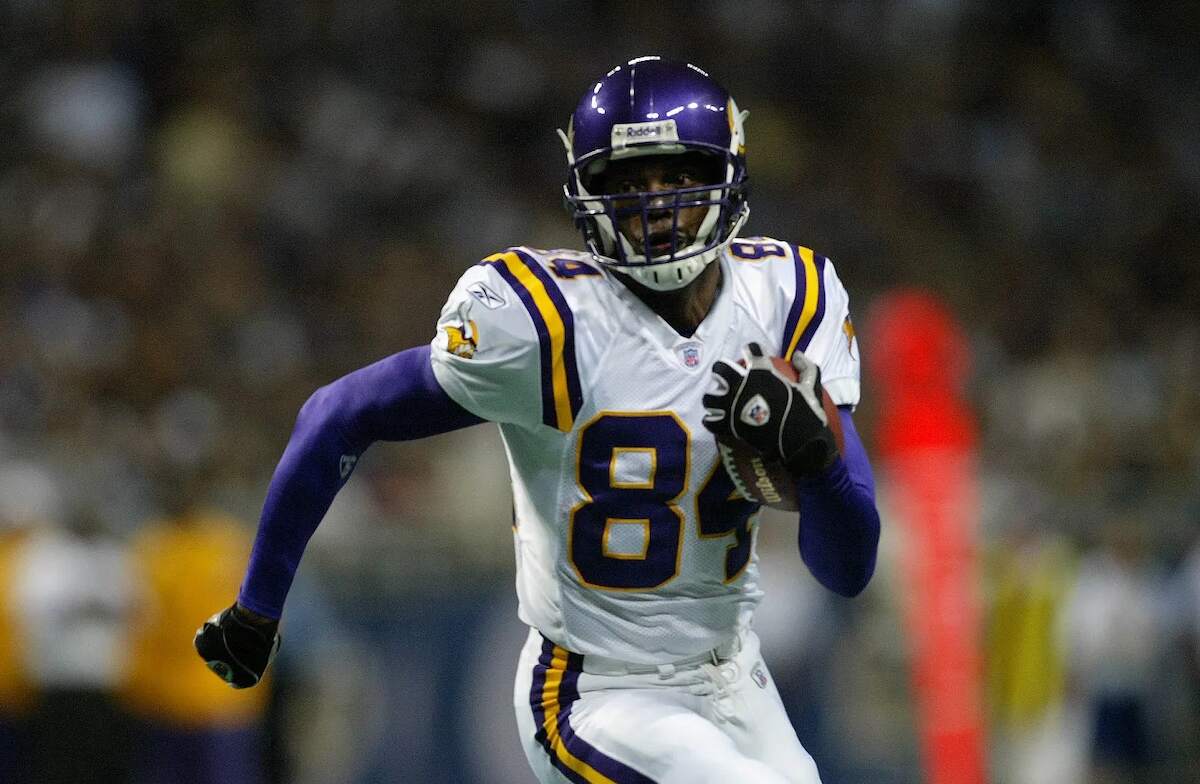 Minnesota Vikings' Randy Moss runs with the football into the end zone