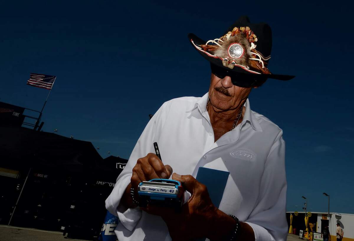 NASCAR legend Richard Petty signs an autograph