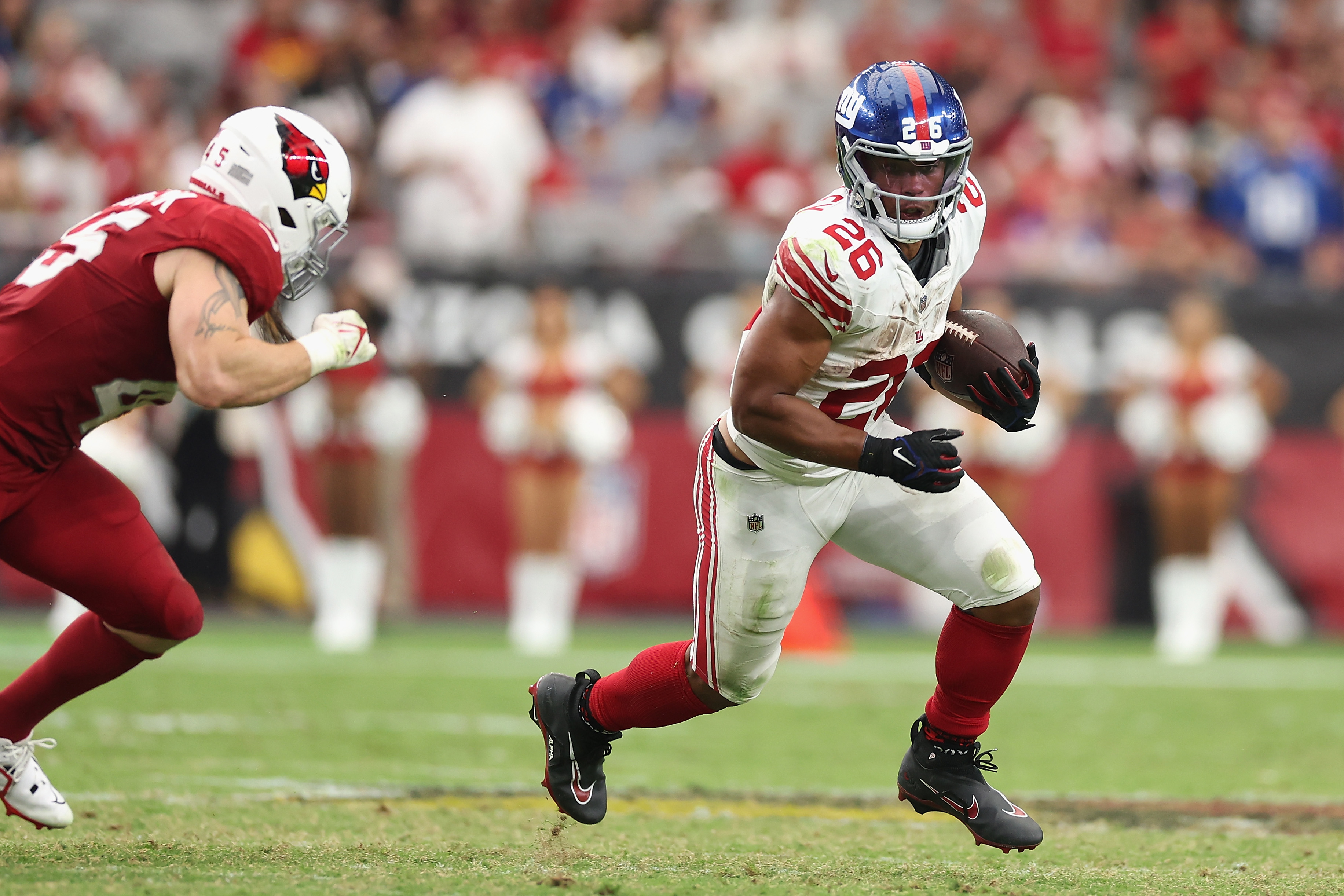 Running back Saquon Barkley of the New York Giants rushes the football against the Arizona Cardinals.