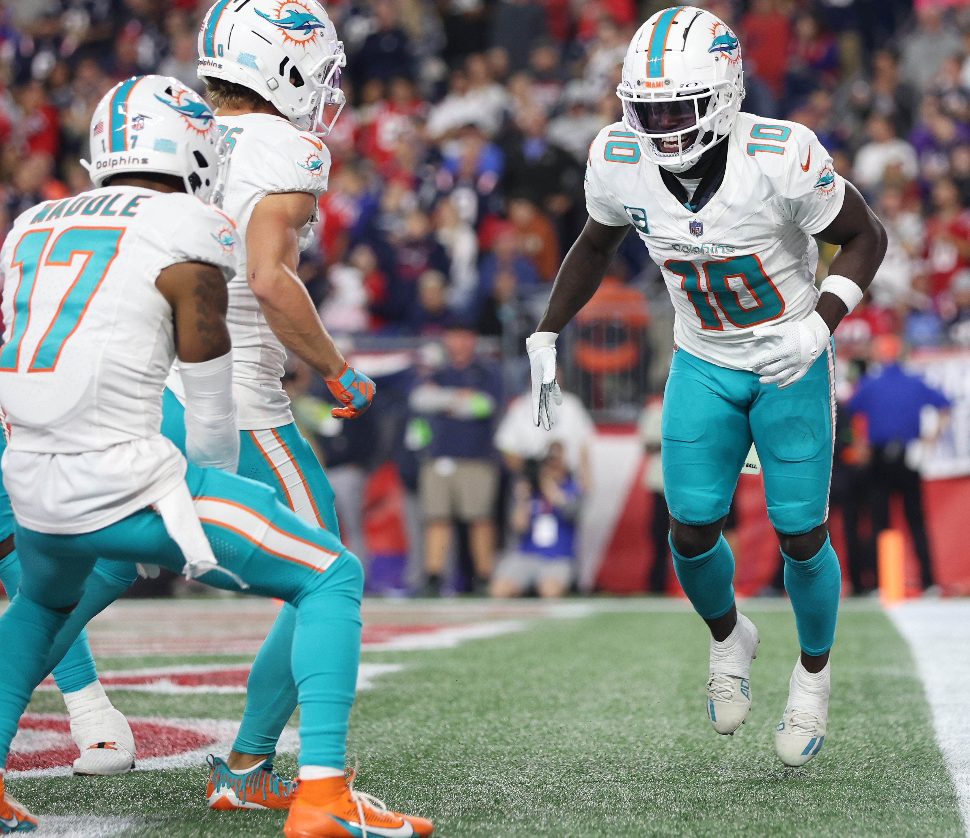 Tyreek Hill of the Miami Dolphins celebrates his touchdown with teammates.